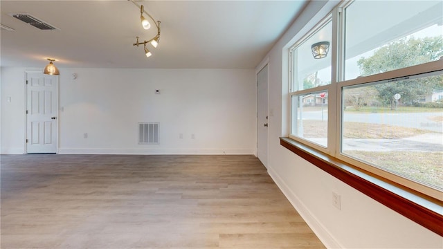 spare room with light wood-type flooring