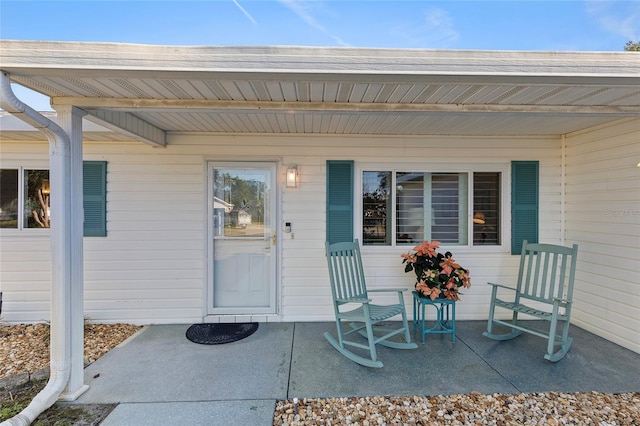 doorway to property featuring covered porch