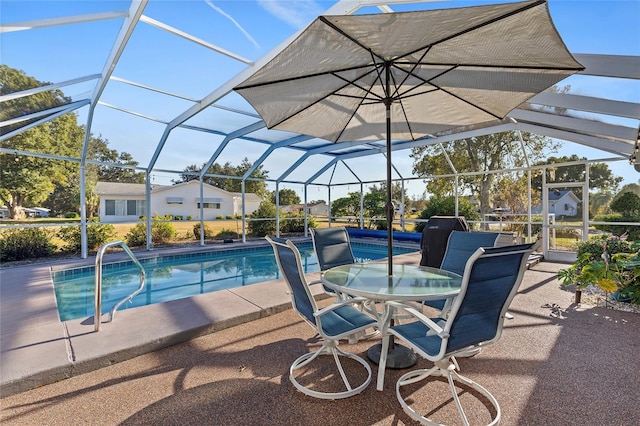 view of swimming pool with a lanai and a patio