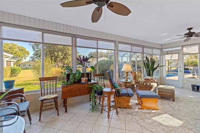 sunroom / solarium with ceiling fan