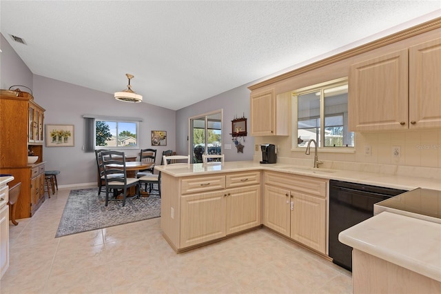 kitchen with dishwasher, sink, kitchen peninsula, a textured ceiling, and vaulted ceiling