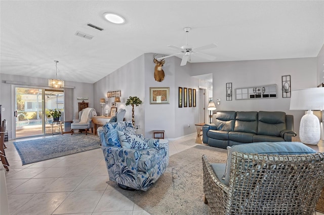 living room featuring ceiling fan with notable chandelier, light tile patterned floors, and vaulted ceiling