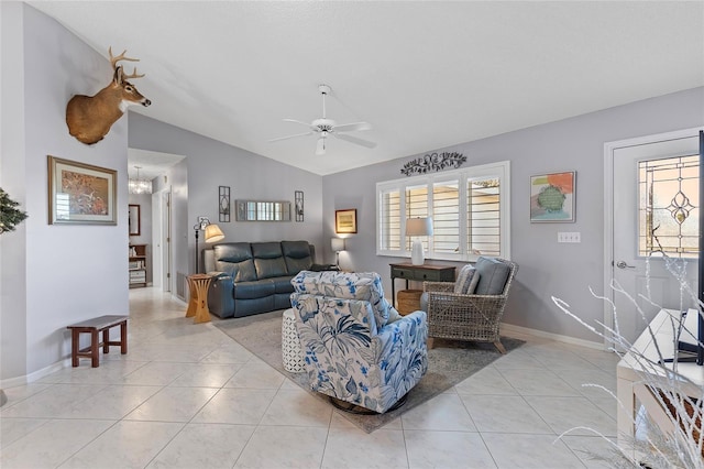 living room with light tile patterned floors, vaulted ceiling, and ceiling fan