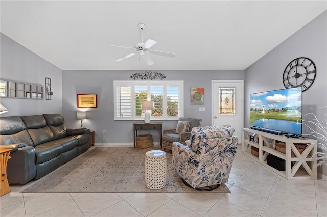 living room with ceiling fan and light tile patterned floors