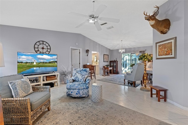 tiled living room with ceiling fan with notable chandelier and vaulted ceiling