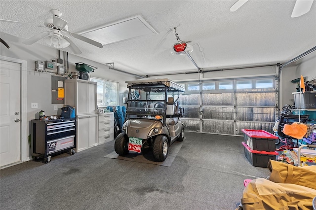 garage with ceiling fan and a garage door opener