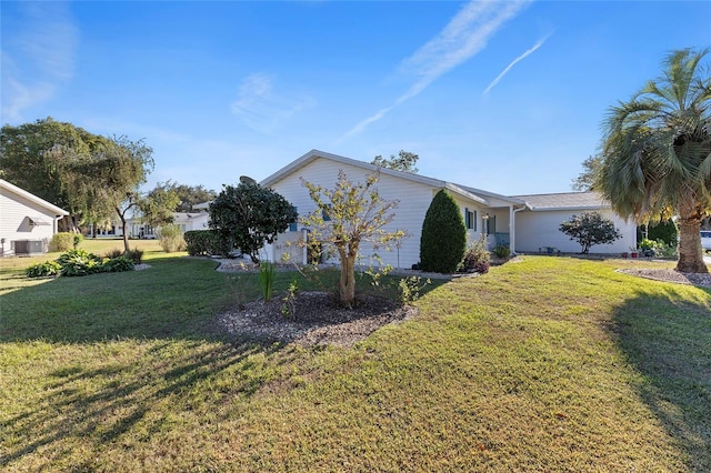 view of property exterior with a lawn