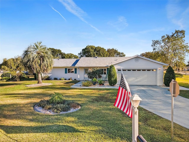 ranch-style home featuring a garage and a front yard