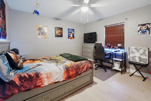 bedroom with light hardwood / wood-style floors and ceiling fan