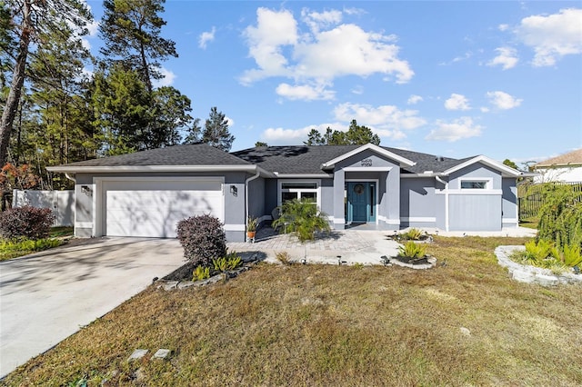 ranch-style home with a front lawn and a garage