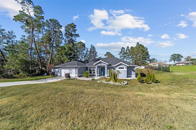 ranch-style home featuring a front lawn and a garage