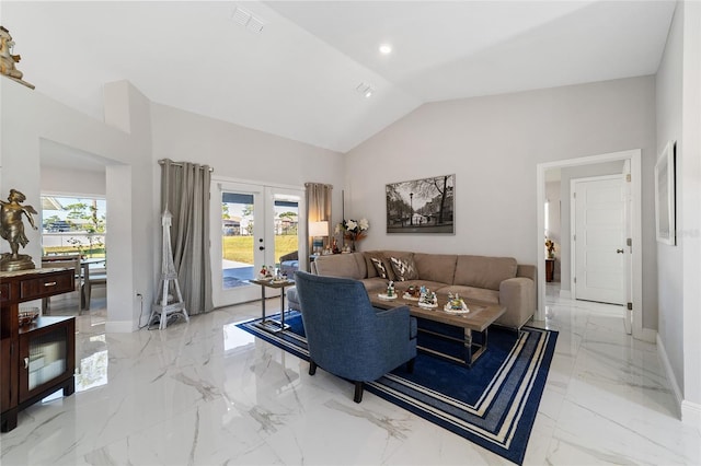 living room featuring high vaulted ceiling, a wealth of natural light, and french doors