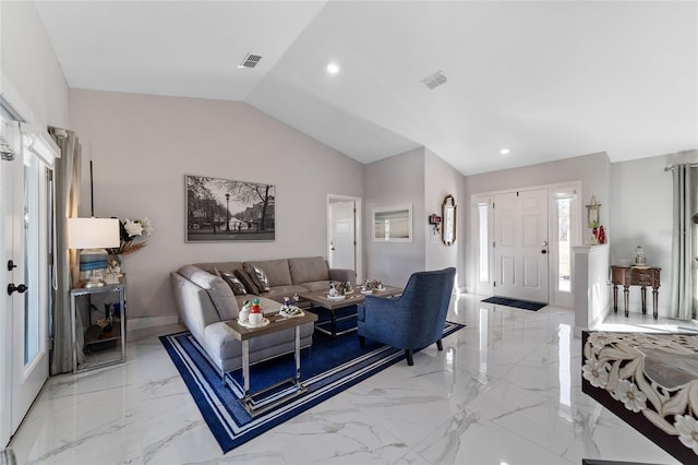 living room featuring lofted ceiling