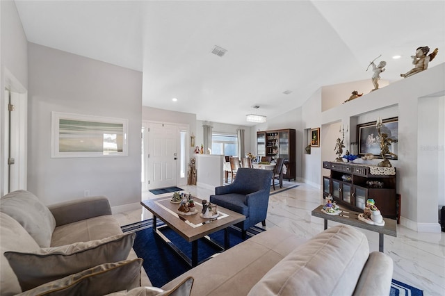 living room featuring vaulted ceiling