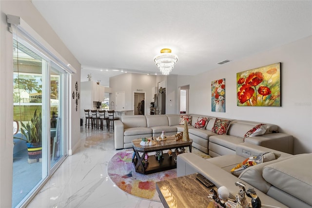 living room featuring a chandelier