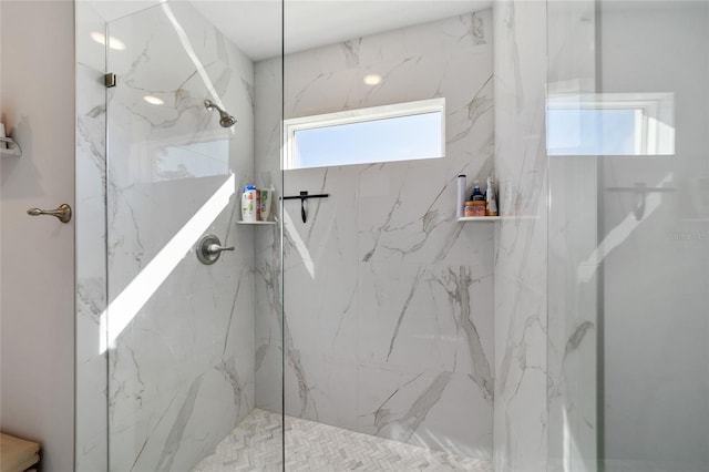 bathroom with a tile shower