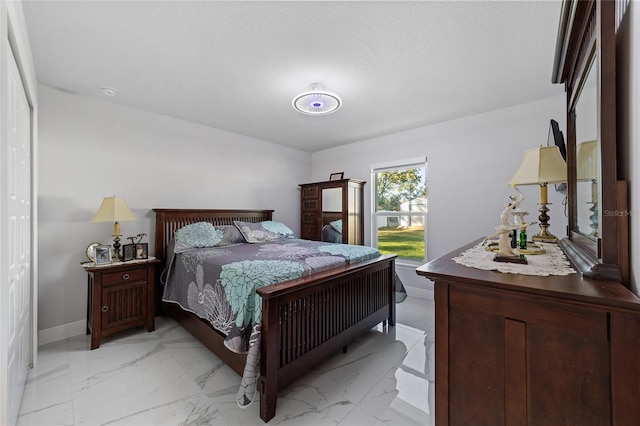 bedroom featuring a textured ceiling