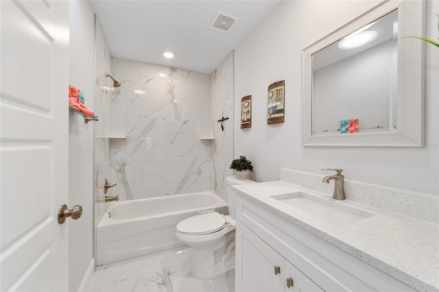 full bathroom with vanity, tiled shower / bath combo, and toilet