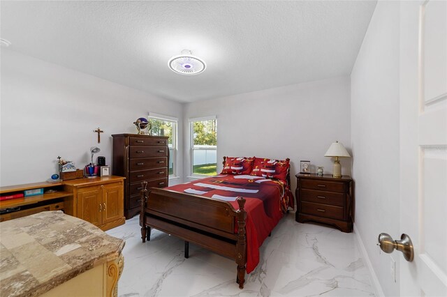 bedroom featuring a textured ceiling