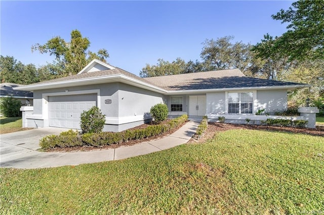 ranch-style house featuring a front yard and a garage