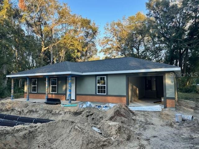 view of front of home with a garage and covered porch