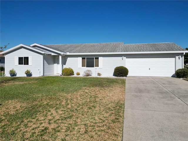 ranch-style home with a front yard and a garage