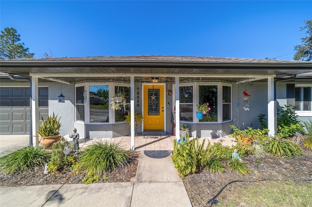 property entrance featuring a porch and a garage