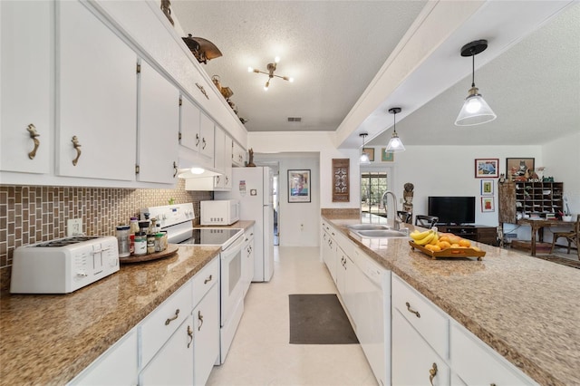 kitchen with white cabinets, white appliances, and sink