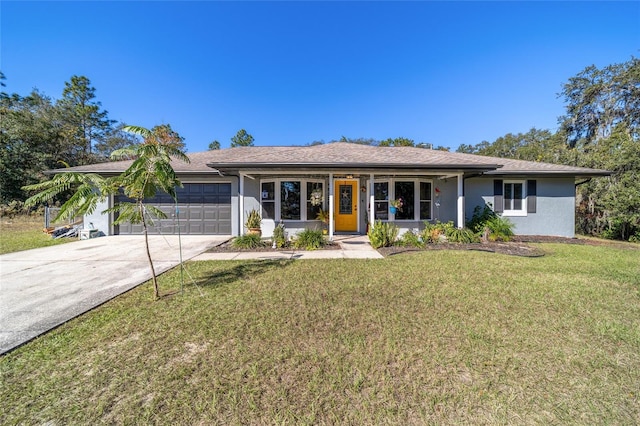 single story home with a front yard and a garage