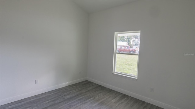 spare room featuring dark hardwood / wood-style floors