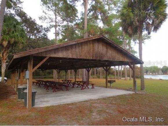 view of community featuring a gazebo, a yard, and a water view