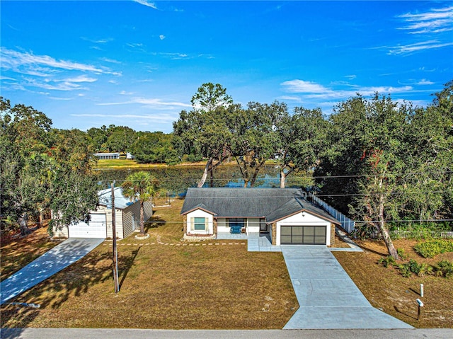 view of front facade with a garage and a front lawn