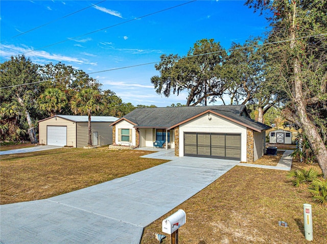 ranch-style house featuring a front lawn, a garage, and a storage shed