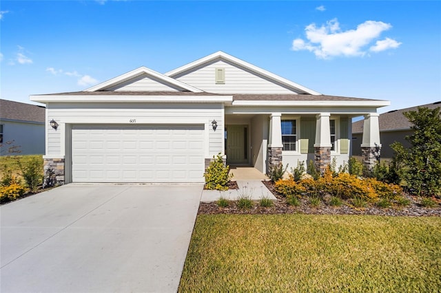 6071 SW 93rd Loop, Ocala, FL 34476 - view of front facade featuring stone siding, concrete driveway, an attached garage, and a front lawn
