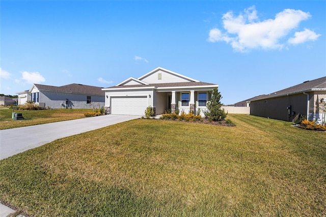 view of front facade with a front yard and a garage