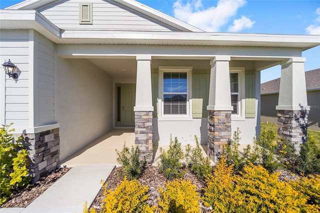 6071 SW 93rd Loop, Ocala, FL 34476 - view of exterior entry featuring stone siding and a porch