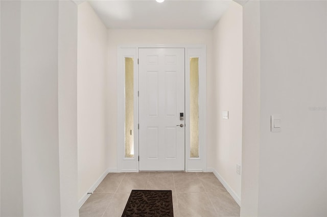 6071 SW 93rd Loop, Ocala, FL 34476 - foyer featuring light tile patterned floors and baseboards