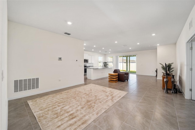 living room with light tile patterned flooring