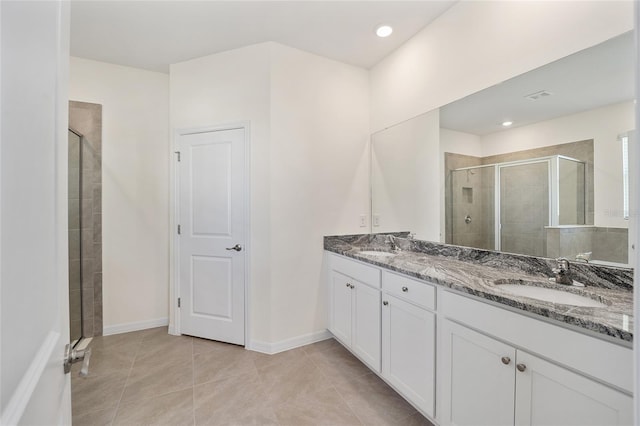 6071 SW 93rd Loop, Ocala, FL 34476 - full bathroom featuring a shower stall, double vanity, tile patterned flooring, and baseboards