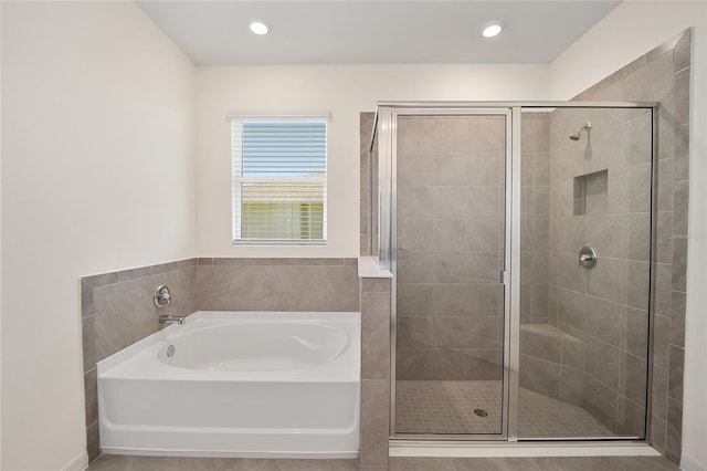 6071 SW 93rd Loop, Ocala, FL 34476 - bathroom featuring a garden tub, a stall shower, and recessed lighting