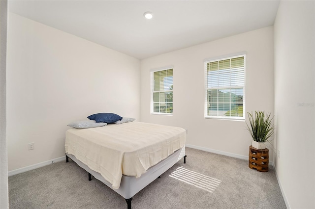6071 SW 93rd Loop, Ocala, FL 34476 - bedroom with light carpet and baseboards