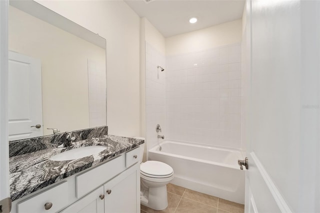 full bathroom featuring tile patterned floors, toilet, vanity, and tiled shower / bath