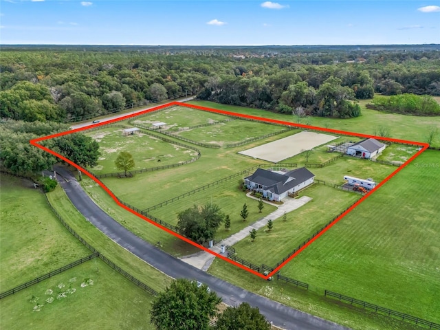 birds eye view of property with a rural view