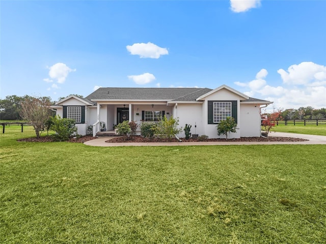 ranch-style house featuring a porch and a front yard