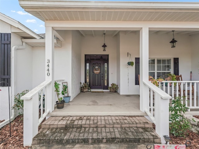 property entrance with covered porch