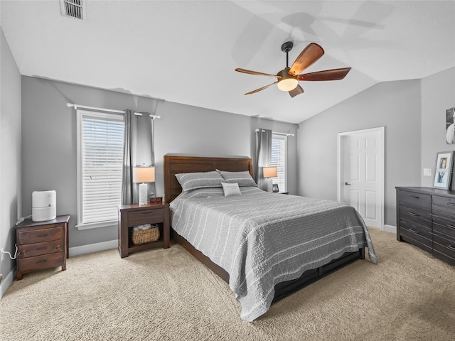 carpeted bedroom with ceiling fan and lofted ceiling