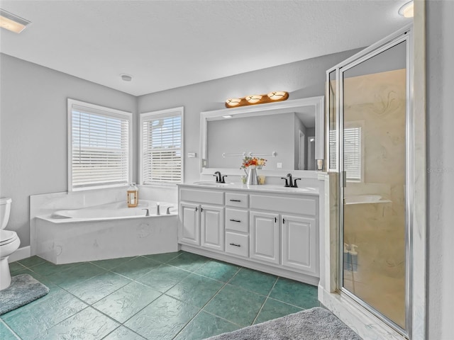 full bathroom with tile patterned flooring, toilet, vanity, and shower with separate bathtub