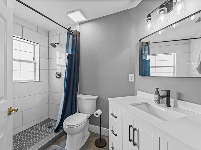 bathroom with a shower with curtain, vanity, and toilet