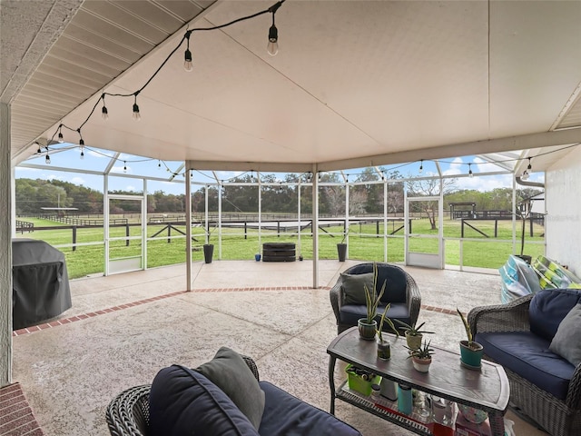 view of patio featuring an outdoor hangout area, a rural view, and area for grilling