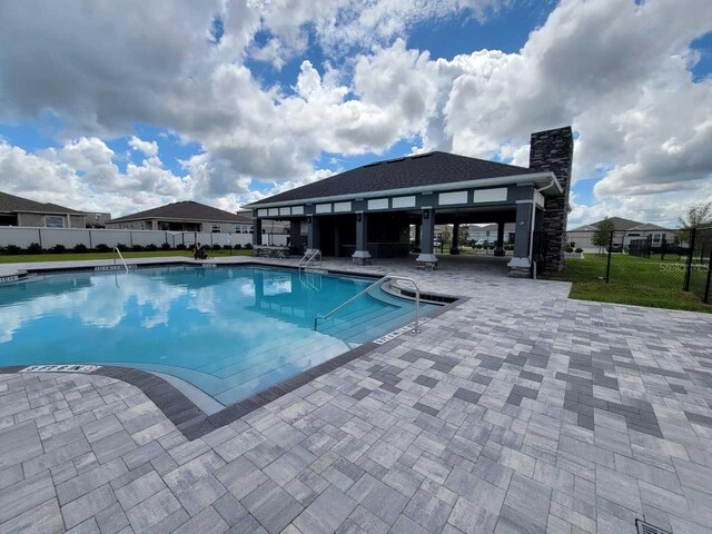 8309 SW 58th Ave, Ocala, FL 34476 - community pool featuring a patio
